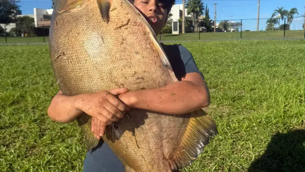 Brazil Teen Catches 88-Pound Fish; Mom Swears It’s Not AI